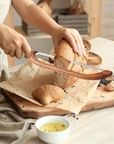 Simmr.™ Bowed Bread Knife